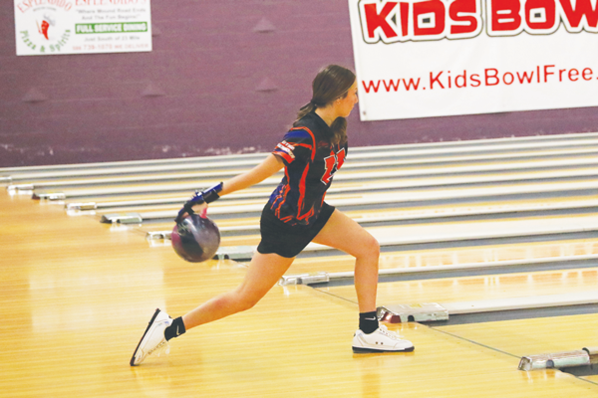  Utica-Eisenhower sophomore Ava Mazza bowls during a league matchup against Sterling Heights Stevenson Dec. 20 at Shelby Lanes. 