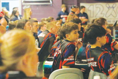  The Utica-Eisenhower boys team looks on during a meet against Sterling Heights Stevenson Dec. 20 at Shelby Lanes. 