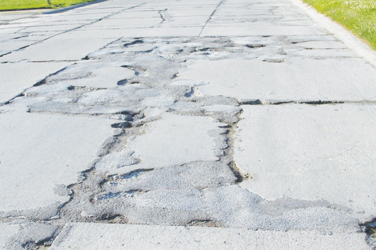  This photo shows a particularly rough section of Commerce Road in the Fraser Industrial Park. The Fraser City Council moved the project forward at its Jan. 9 meeting. 