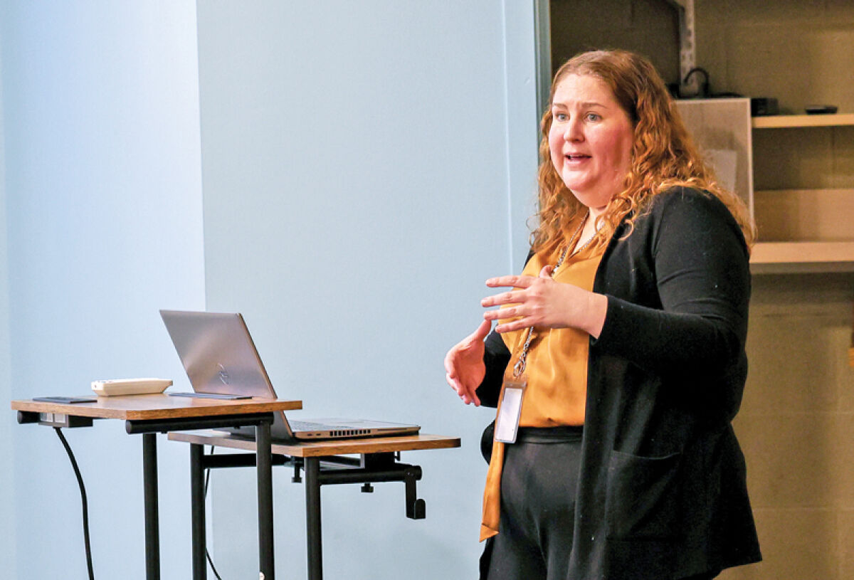  Angela Fox, sustainability manager for the city of Royal Oak, informs the Royal Oak community about the Battle of the Buildings program at an informational night Jan. 16 at the Royal Oak Public Library, 222 E. 11 Mile Road.  