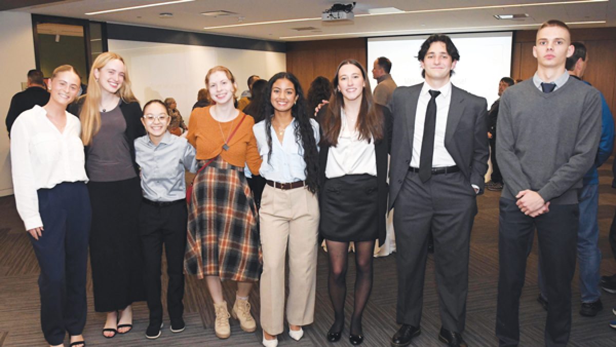  Many of the University Liggett School students who worked on “Invisible Labor” gather for a group photo. 