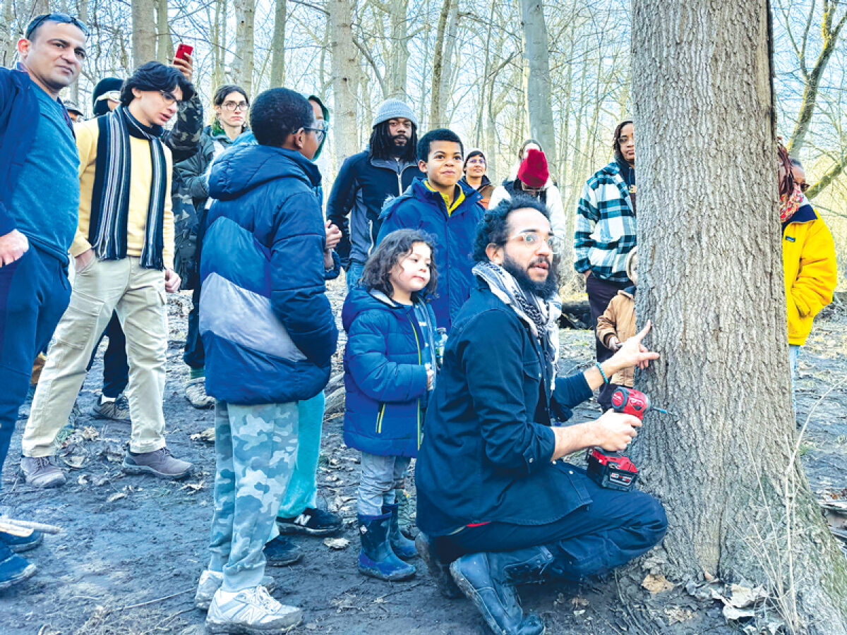  Antonio Cosme leads a maple syrup making presentation at Rouge Park. 