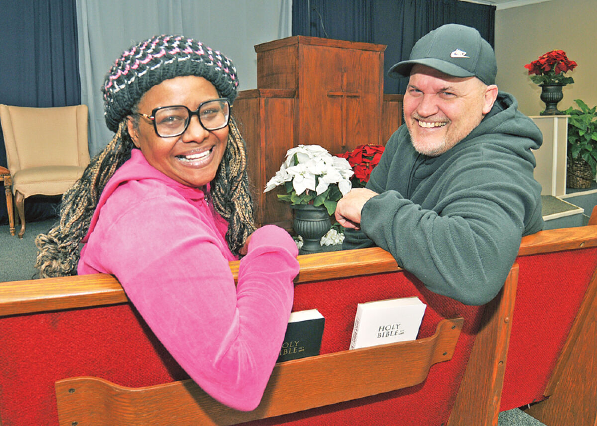  Two of the 13 filmmakers who own Collective Studios, Tonja “Tee-tee” Brown and Rockey Black, sit inside a chapel set. Black said that he focuses on creating thrillers and faith-based films.  