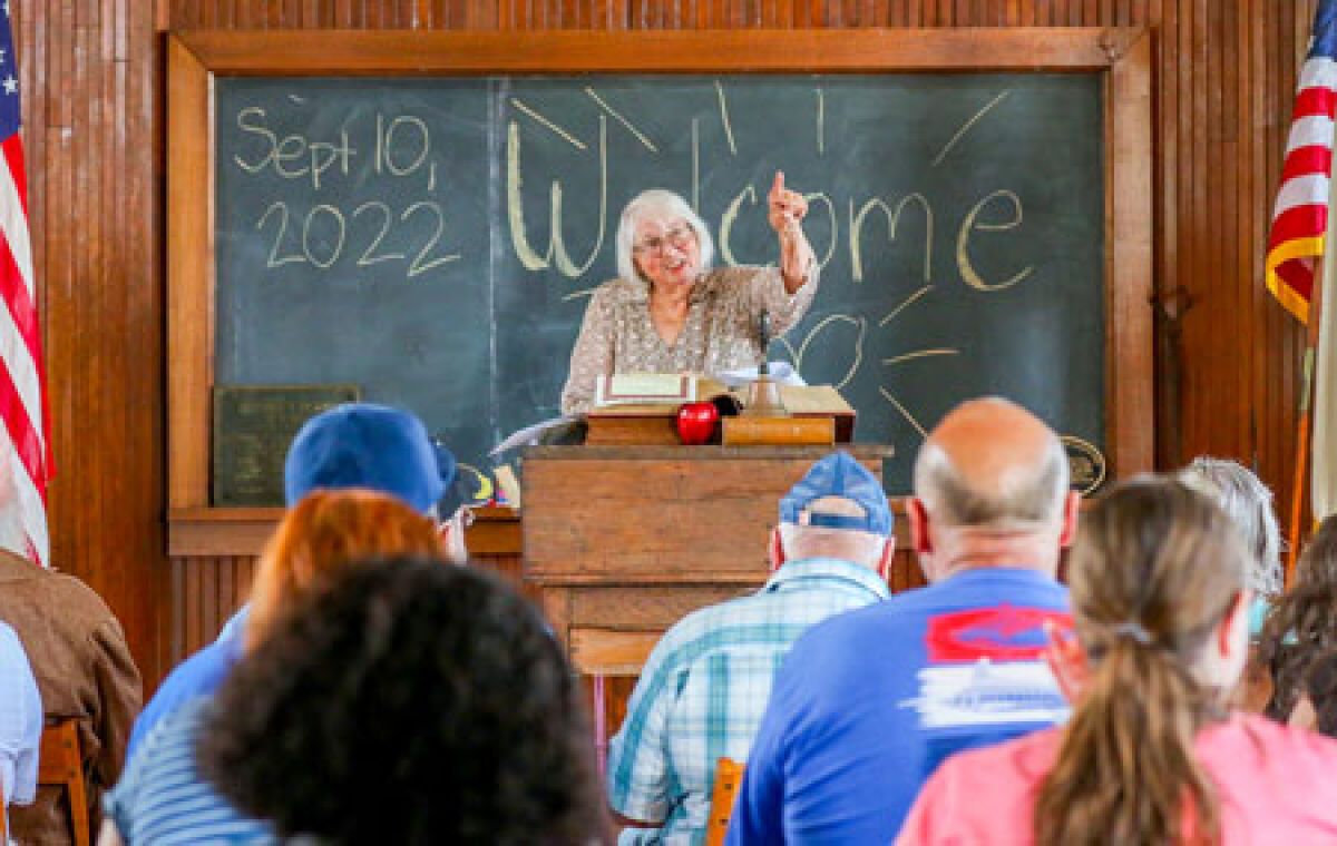  Former Eastpointe Mayor Suzanne Pixley speaks about the history of the schoolhouse Sept. 10. 
