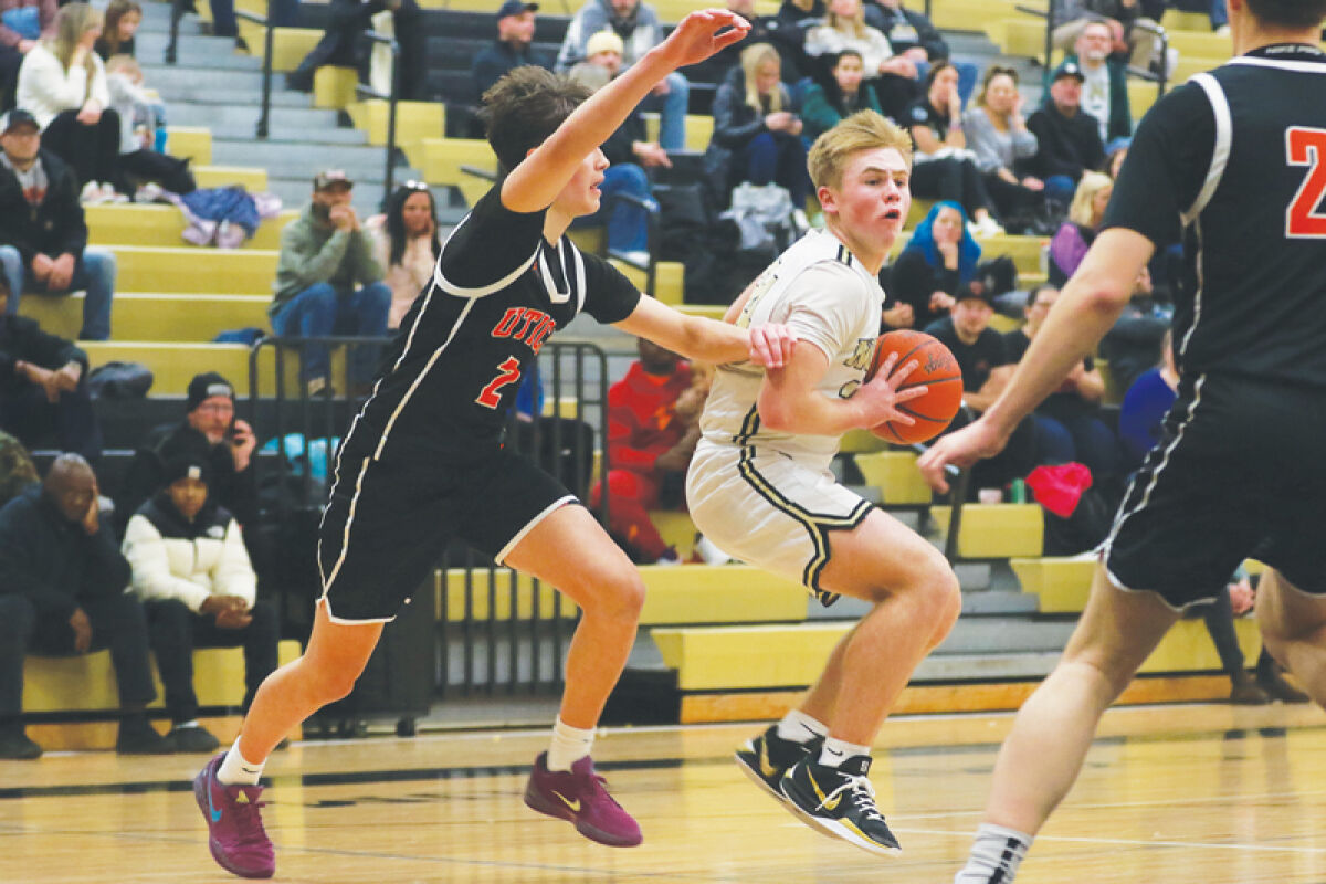  Macomb L’Anse Creuse North senior Ricky Sparks goes up against a Utica defender Jan. 15 at L’Anse Creuse North High School. 