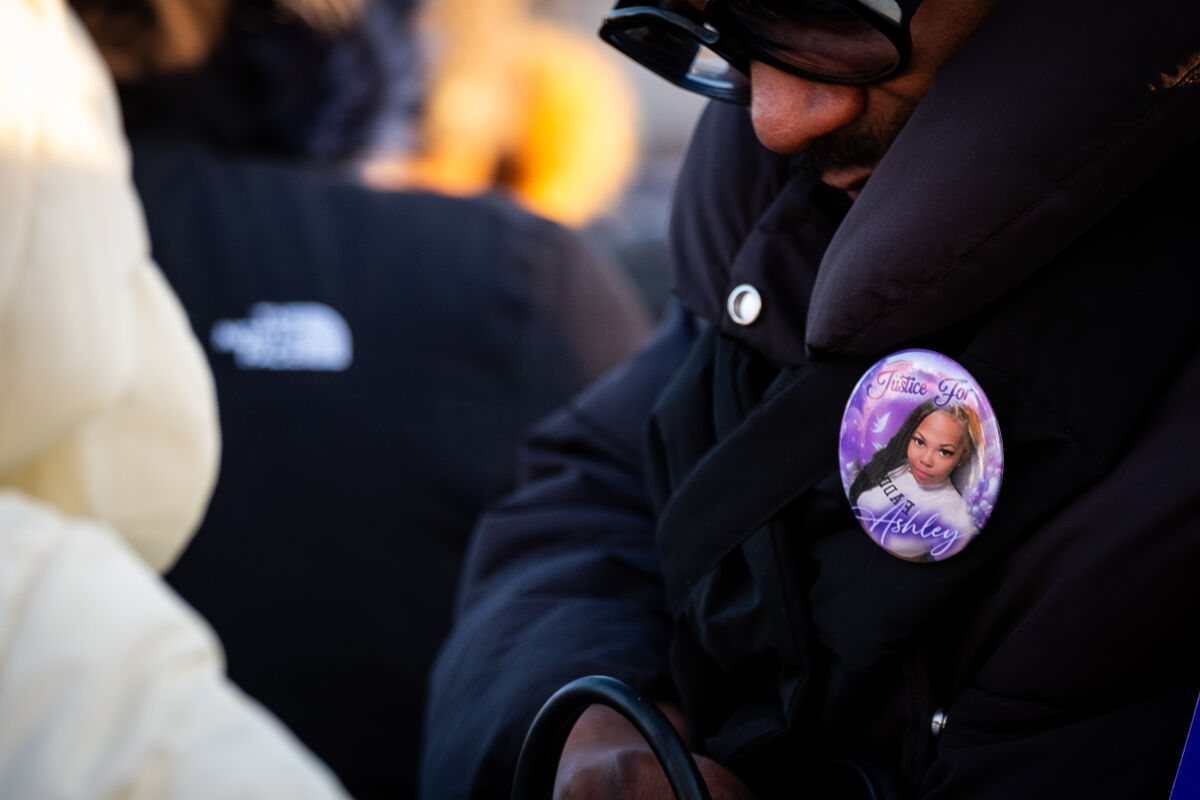  A person wearing a pin supporting justice for Ashley Elkins attends a vigil in her memory on Saturday, Jan. 25, in Roseville. 