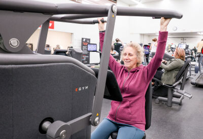  Sue Rauschert, of Royal Oak, works out on the shoulder press that is part of the South Oakland Family YMCA's new EGYM equipment. 