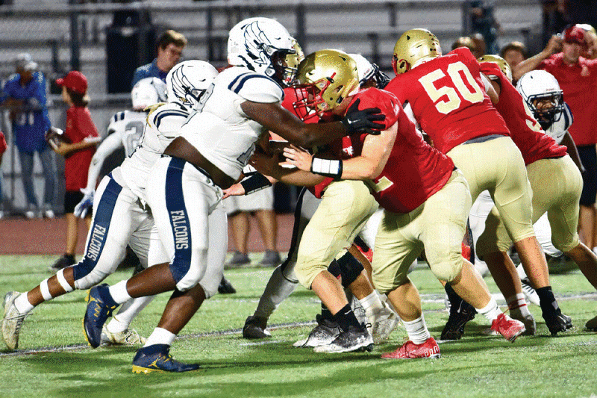  Farmington and Troy Athens battle in the trenches in Farmington’s 28-14 win Sept. 9 at Troy Athens High School. 