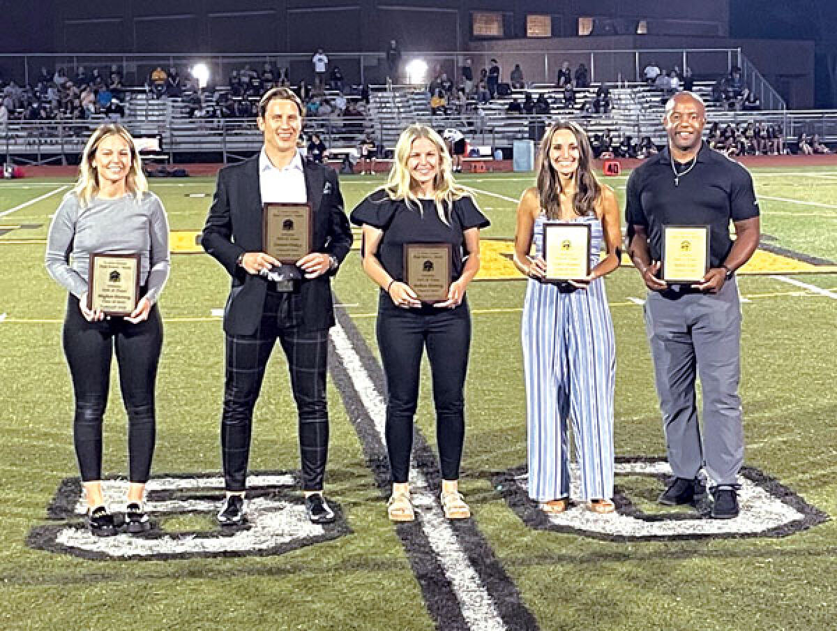  L’Anse Creuse North High School honored five new faces into its Athletic Hall of Fame during halftime at North’s football game against Port Huron Northern on Sept. 9. From left are Meghan Hartwig, Steven Olesky, Melissa Hartwig, Emily Nieman and Robert Giles. 