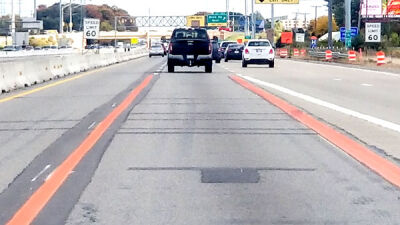  The Michigan Department of Transportation and the Automotive Safety Council are trying out orange safety markings in the Flex Route Project construction zone along Interstate 96 in Novi. The organizations are interested in the effects of the orange markings on both drivers and driver-assistance technology. 